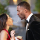 Bachelor Matt James slurps a spaghetti noodle with a contestant